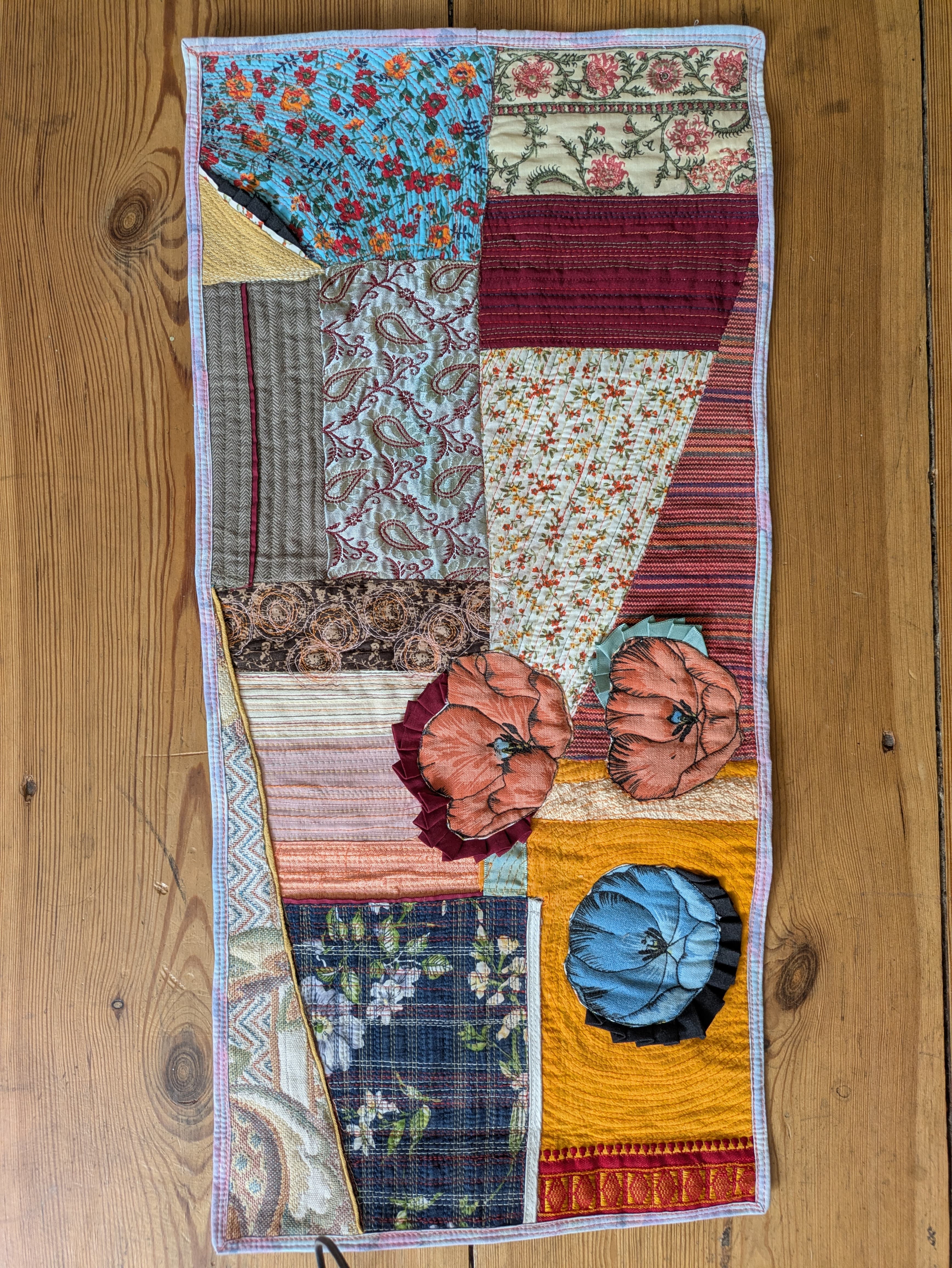 a hand-stitched patchwork quilt.