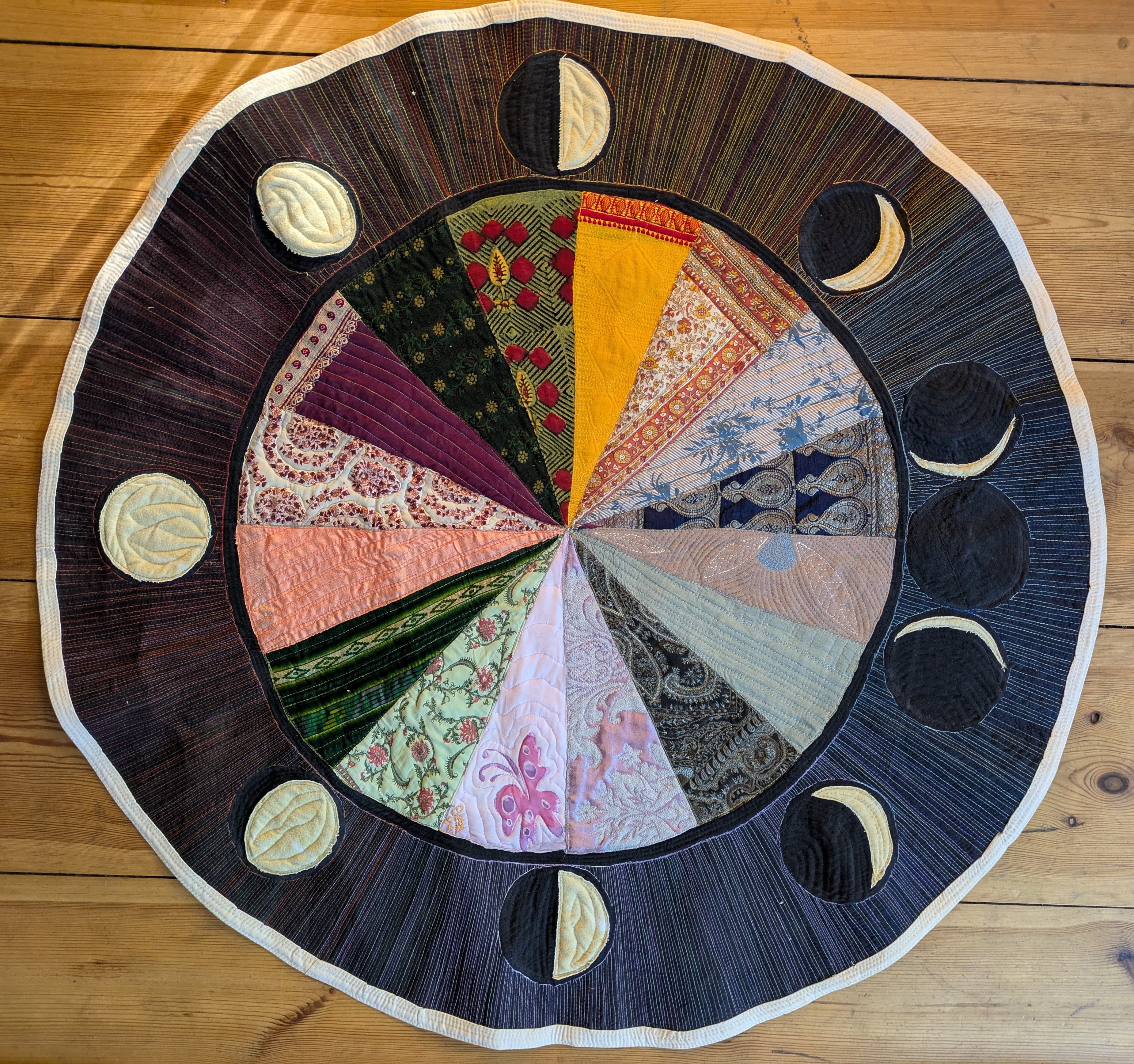 a second hand-stitched patchwork quilt.